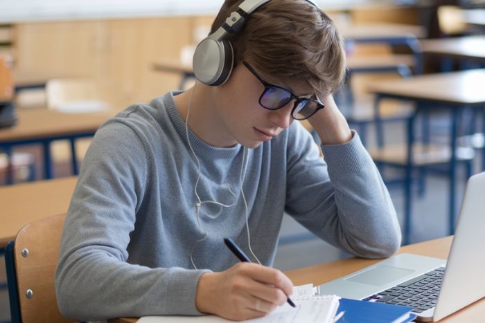 student-doing-a-listening-activity-in-classroo